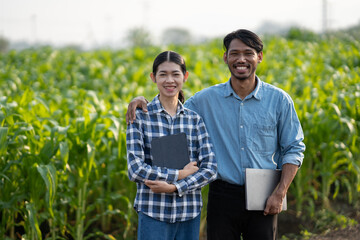 Portrait of young agriculturist working in the crops failed, standing with confidence and smiling...