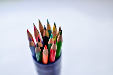 Pencils on a white background. Colored pencil art stock photo.