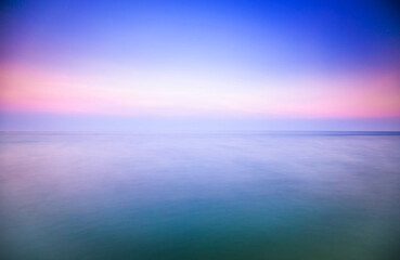 vivid soft pastel seascape view background with blurred effect from long exposure