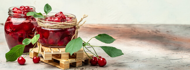 Berries cherry with syrup. Berries cherry with syrup. Canned fruit on a light background. Long banner format