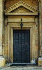 Fototapeta na wymiar Metal medieval beautiful door. Church of the Conversion of Saint Paul in Krakow.