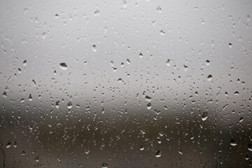 Rain drops on transparent window glass, wet glass