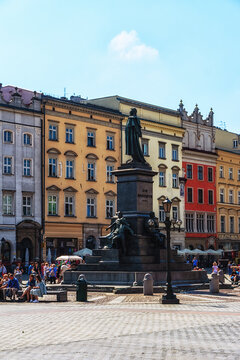 View of the main square in Krakow with the statue of Adamowi Narod