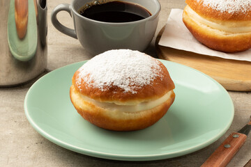 Berlin ball or sonho served with coffee.