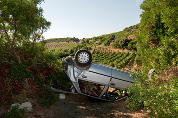 Crashed car overturned in a field, Corse France