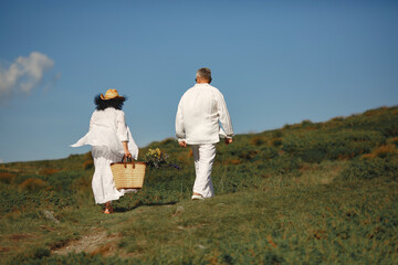 Adult couple walk in the mountains