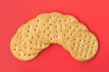 Overhead shot of vegetable crackers on red