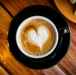 Top view of hot coffee latte art heart shape foam isolated on white background, clipping path included