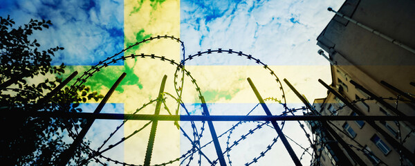 Swedish national flag overlay prison building with fence and wire