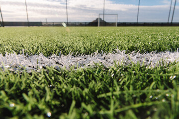 Close-up of mini soccer field lines. Background soccer pitch grass football stadium ground view....