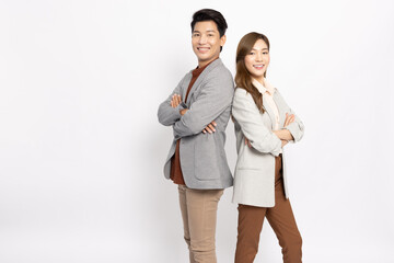 Portrait of successful business asian couple in suit with arms crossed and smile isolated over white background - 568875352