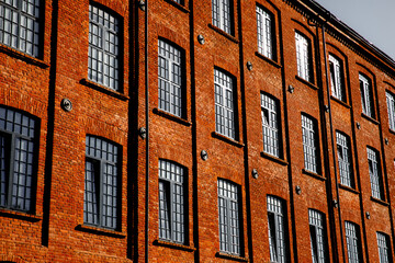 Red brick facade of the factory.