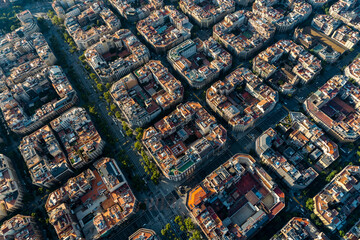 Fototapeta premium Aerial view of typical buildings of Barcelona cityscape from helicopter. top view, Eixample residencial famous urban grid