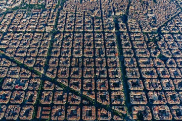 Fotobehang Aerial view of typical buildings of Barcelona cityscape from helicopter. top view, Eixample residencial famous urban grid © ikuday