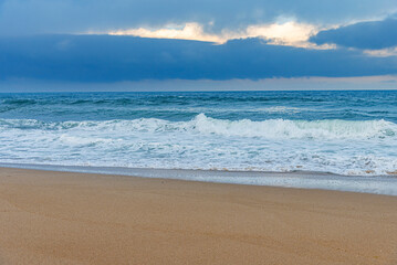 Storm sea. Waves on the sea dispersed by the wind on a cloudy day.