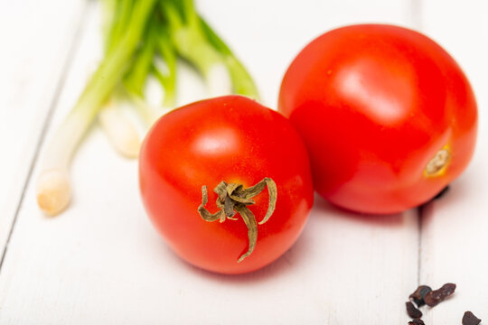 tomatoes on a wooden board