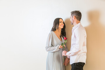 Man giving red rose to his girlfriend