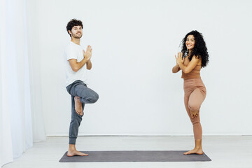 Obraz premium pose yoga asana namaste stretch body exercise trainer classes in the gym