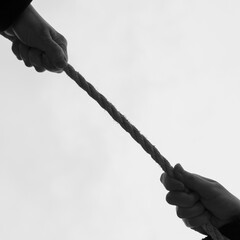 Tension between people, pulling ropes