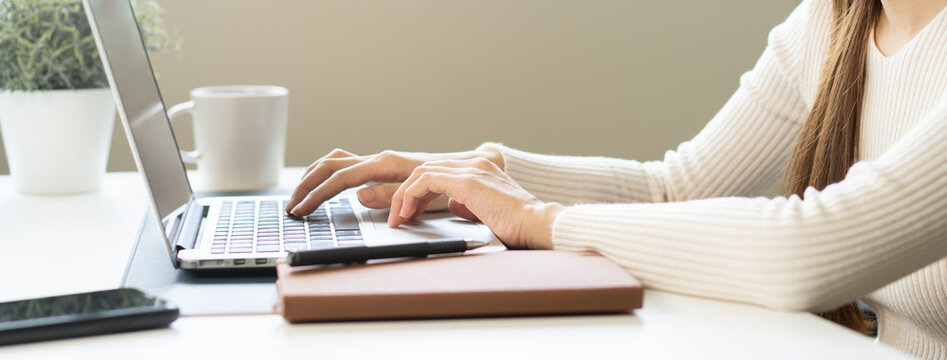 Close Up Hand Of High School Student Woman Studying, Learning Online Academic Lesson In University Library Using The Laptop Computer, Concept Of Education.