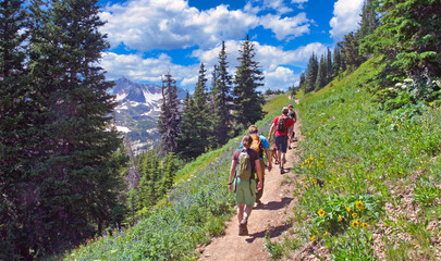 Group of hikers heading up the Arapaho Pass Trail in Boulder County, Colorado's Indian Peaks...