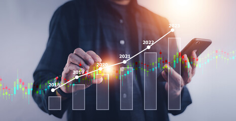 Businessman using digital chart for Current and Future Business Investment Strategies, Business...