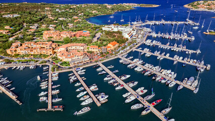 Italy, Sardegna island. Luxury resort Porto Cervo. Marina with sailing boats, aerial drone high...
