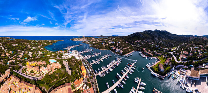 Italy, Sardegna island. Luxury resort Porto Cervo. Marina with sailing boats, aerial drone video view