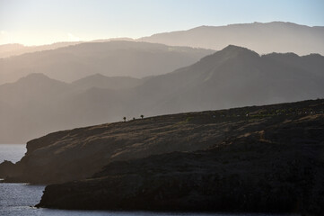 Fototapeta premium Red earth and rocks at sunset