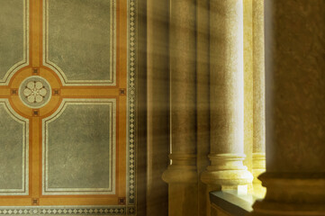 The sun's rays passing between the columns and shining on the antique interior