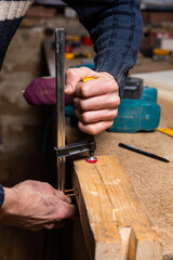 A carpenter works in a furniture workshop