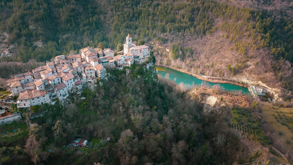 Italy, February 2023: aerial view of the medieval village of castel Trosino perched on a rock spur....