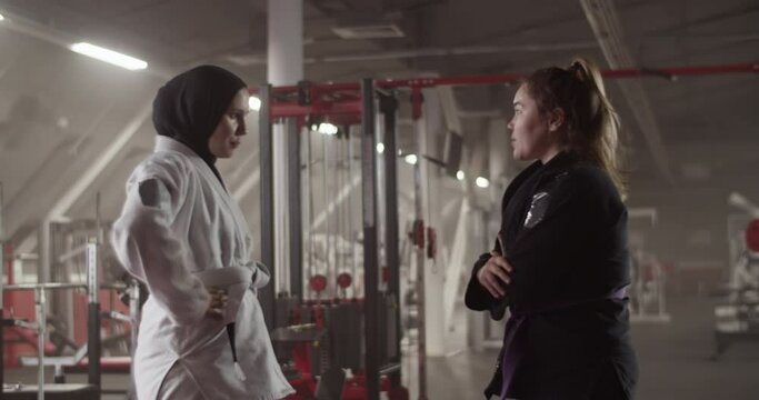 Female trainer supporting Muslim fighter