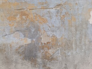 Wall fragment with scratches and cracks.Old distressed wall backdrop, grunge background or texture.Grunge white metal wall with peeling paint, close-up background photo texture.Peeling wall texture.