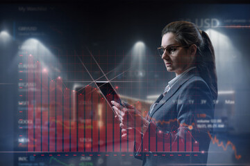 Fototapeta premium Businesswoman analyzes the graph of the financial crisis fall .
