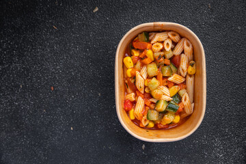 pasta salad tomato, cucumber, corn, vegetable, penne pasta meal food snack on the table copy space food background rustic top view 