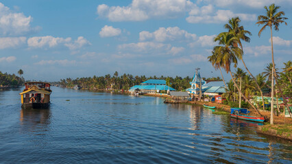 Fototapeta premium ‘The Venice of the East’- Alleppey. Huge network of backwaters and more than thousand the houseboats add to the magic of the place.