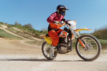 Man riding motorbike on motocross track.Extreme and Adrenaline. Motocross rider in action. Motocross sport. Active lifestyle