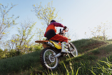 Man riding motorbike on motocross track.Extreme and Adrenaline. Motocross rider in action. Motocross sport. Active lifestyle