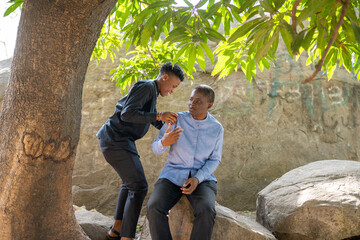 Two queer masculine women at the park
