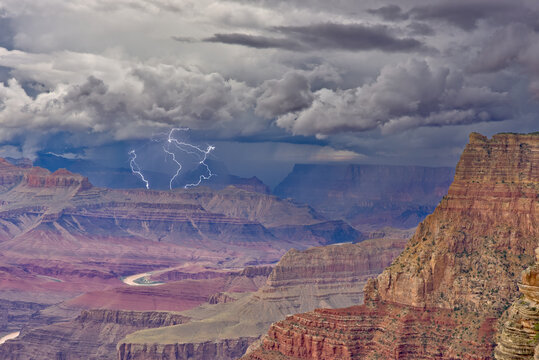 A large storm rolling across the North Rim of the Grand Canyon in Arizona. Viewed from the South Rim between Zuni and Papago Points.