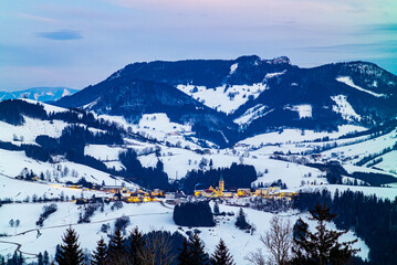 mountain landscape near the village of maria neustif in upper austria on an evening in winter