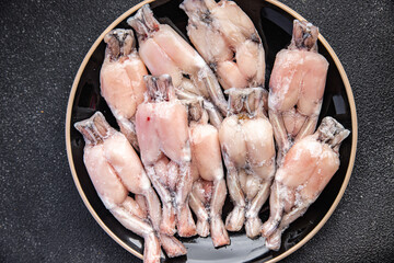 frog leg frozen meat frozen food meal food snack on the table copy space food background rustic top...