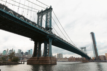 Fototapeta na wymiar Manhattan bridge and skyline with skyscrapers of New York City on background.