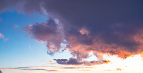 Beautiful orange bright sunset sky with dramatic clouds. Sunset sky background.