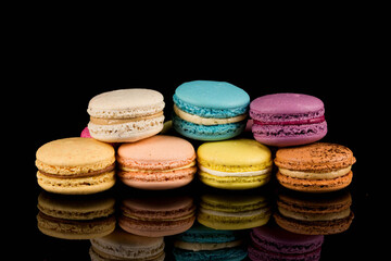 Colorful macaroon over black background