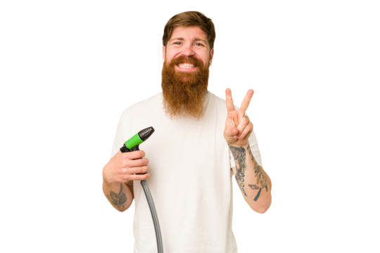 Adult man holding a watering hose isolated showing number two with fingers.