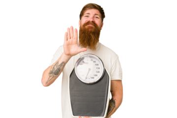 Adult redhead man with long beard holding a scale isolated cut out smiling cheerful showing number five with fingers.