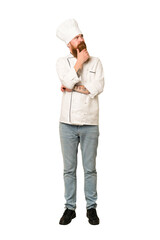 Full body adult cook man cut out isolated looking sideways with doubtful and skeptical expression.