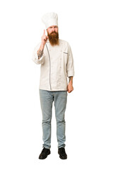 Full body adult cook man cut out isolated showing number one with finger.